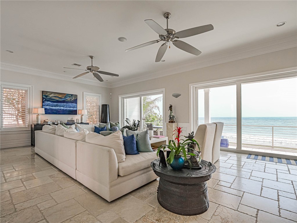 2250 Sanderling Lane Vero Beach, FL 32963 - Photo 5 of 36 a living room with furniture and a potted plant