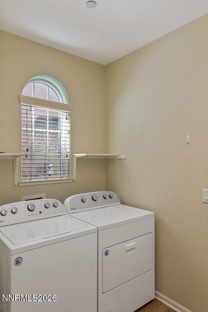 1864 Wind Ranch Road, Unit B Reno, NV 89521 - Photo 32 of 42 a utility room with dryer and washer