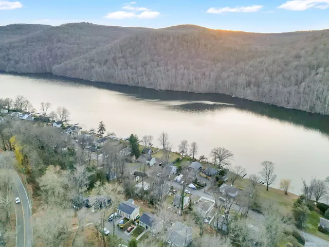 a view of a dry yard with mountains in the background