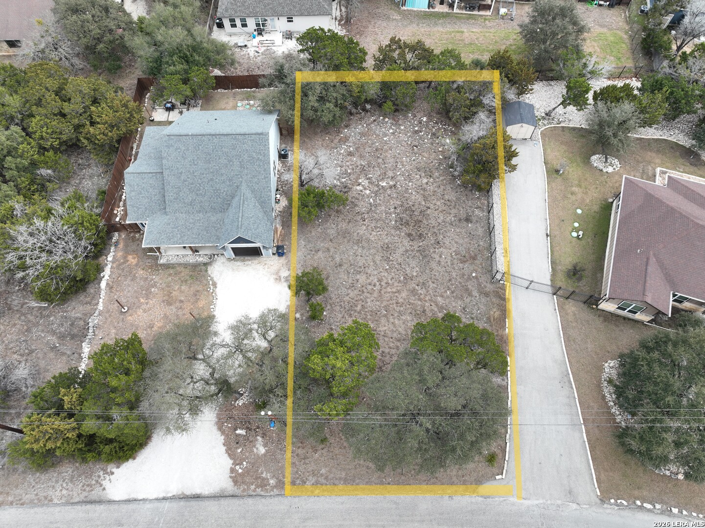 an aerial view of a house with a yard