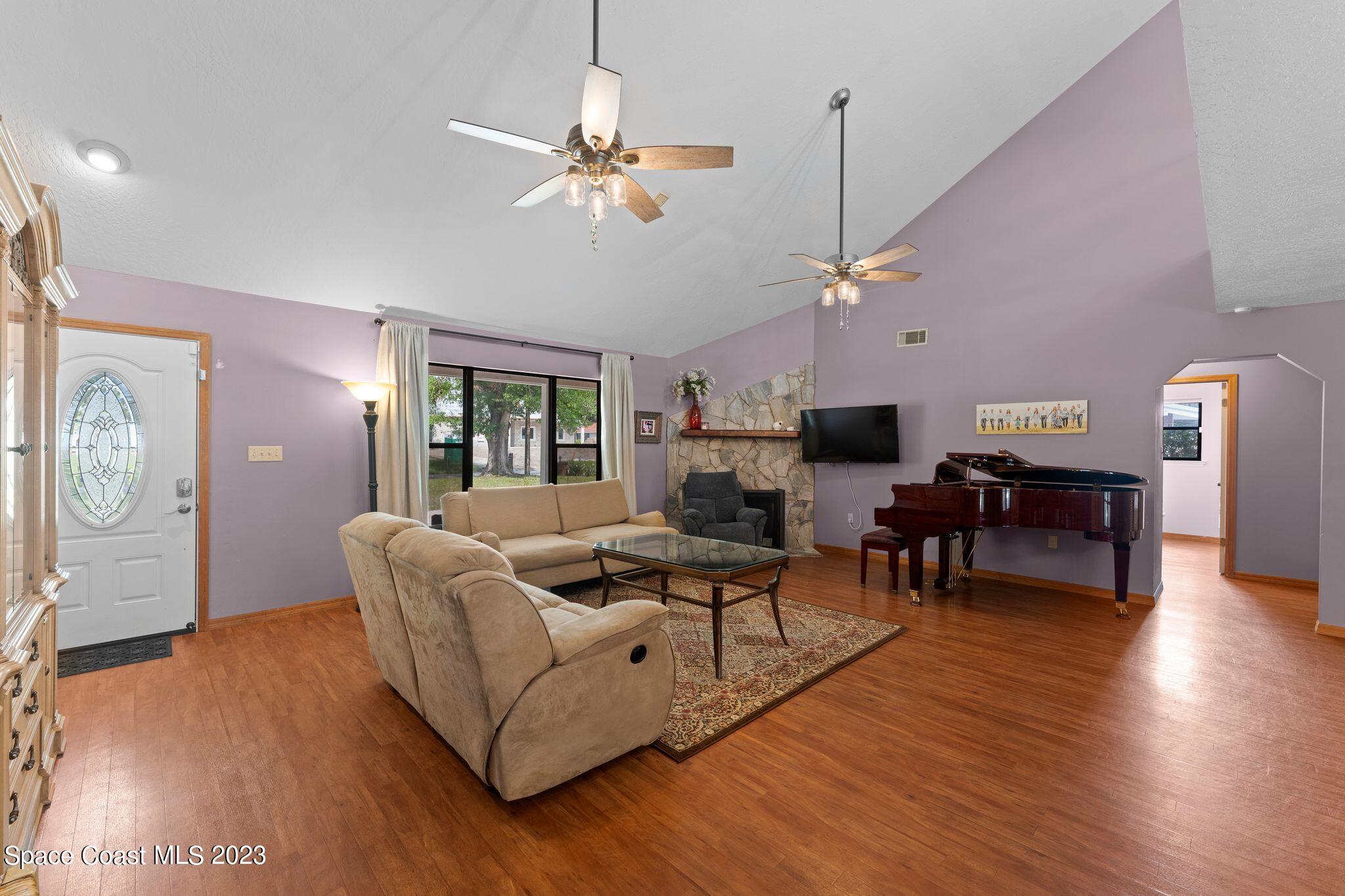 3704 Windsor Drive Cocoa, FL 32926 - Photo 15 of 48 a living room with furniture and wooden floor
