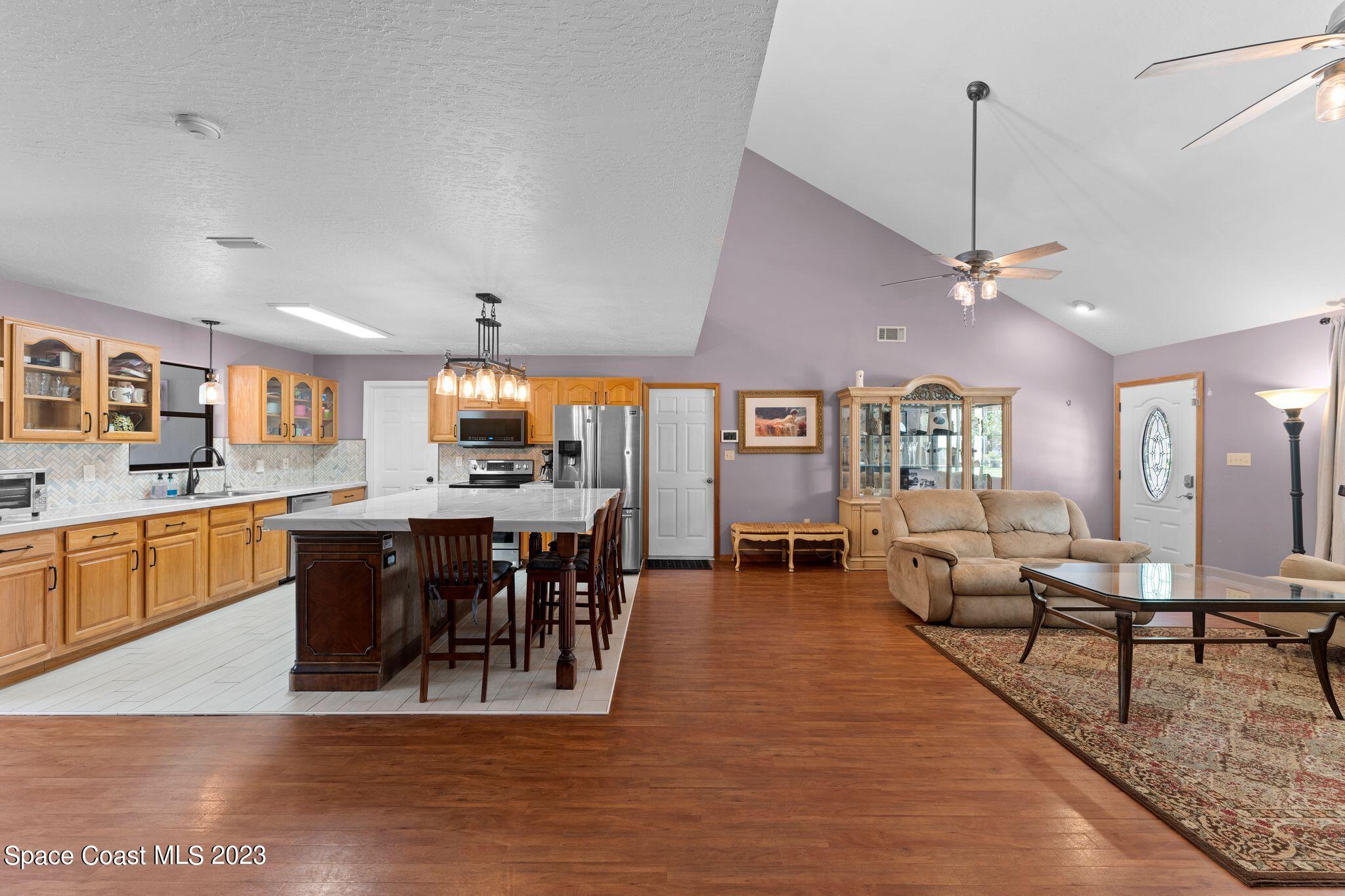 3704 Windsor Drive Cocoa, FL 32926 - Photo 17 of 48 a view of a dining room with furniture window and wooden floor