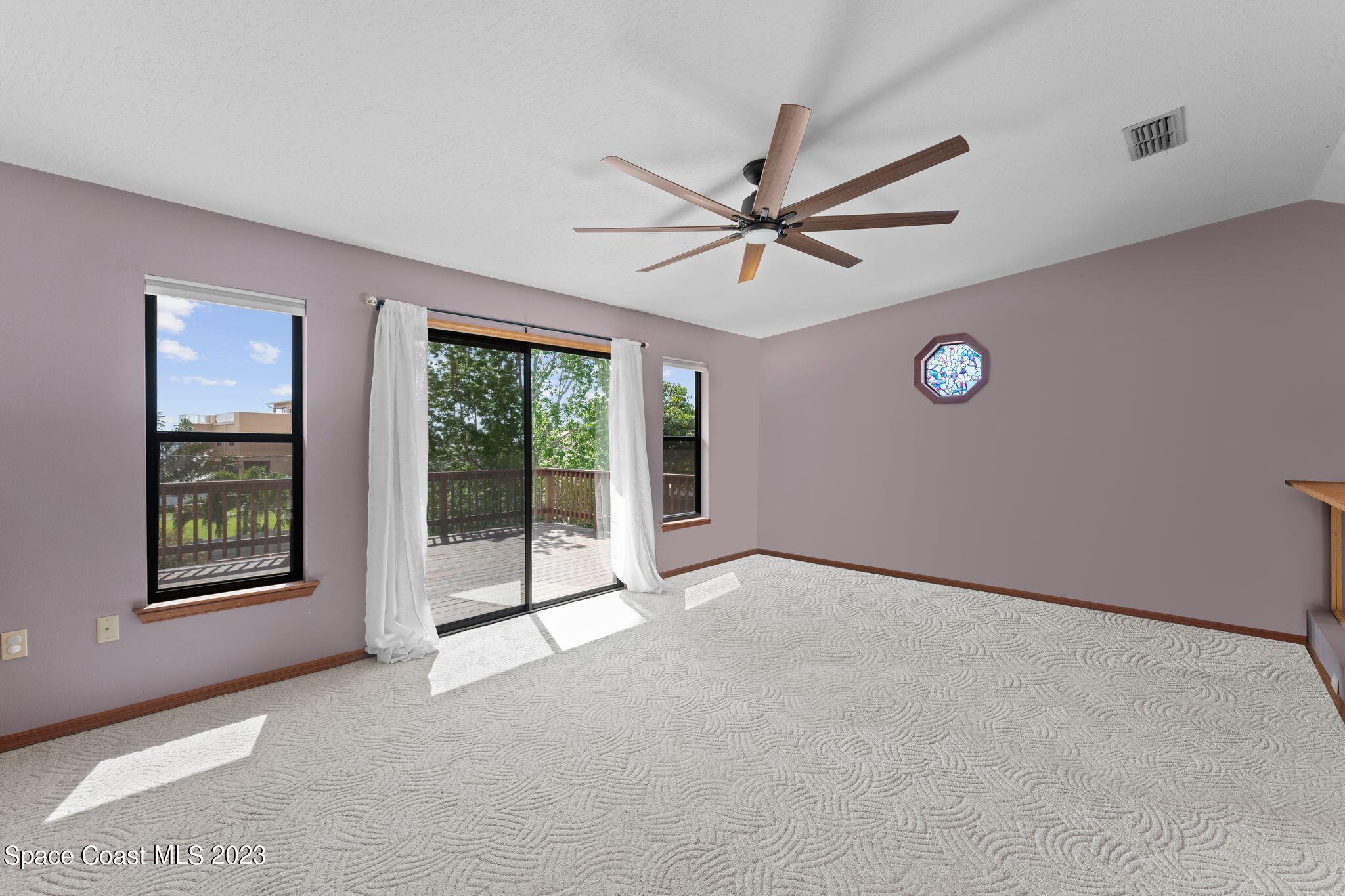 3704 Windsor Drive Cocoa, FL 32926 - Photo 21 of 48 a view of a livingroom with a ceiling fan and window