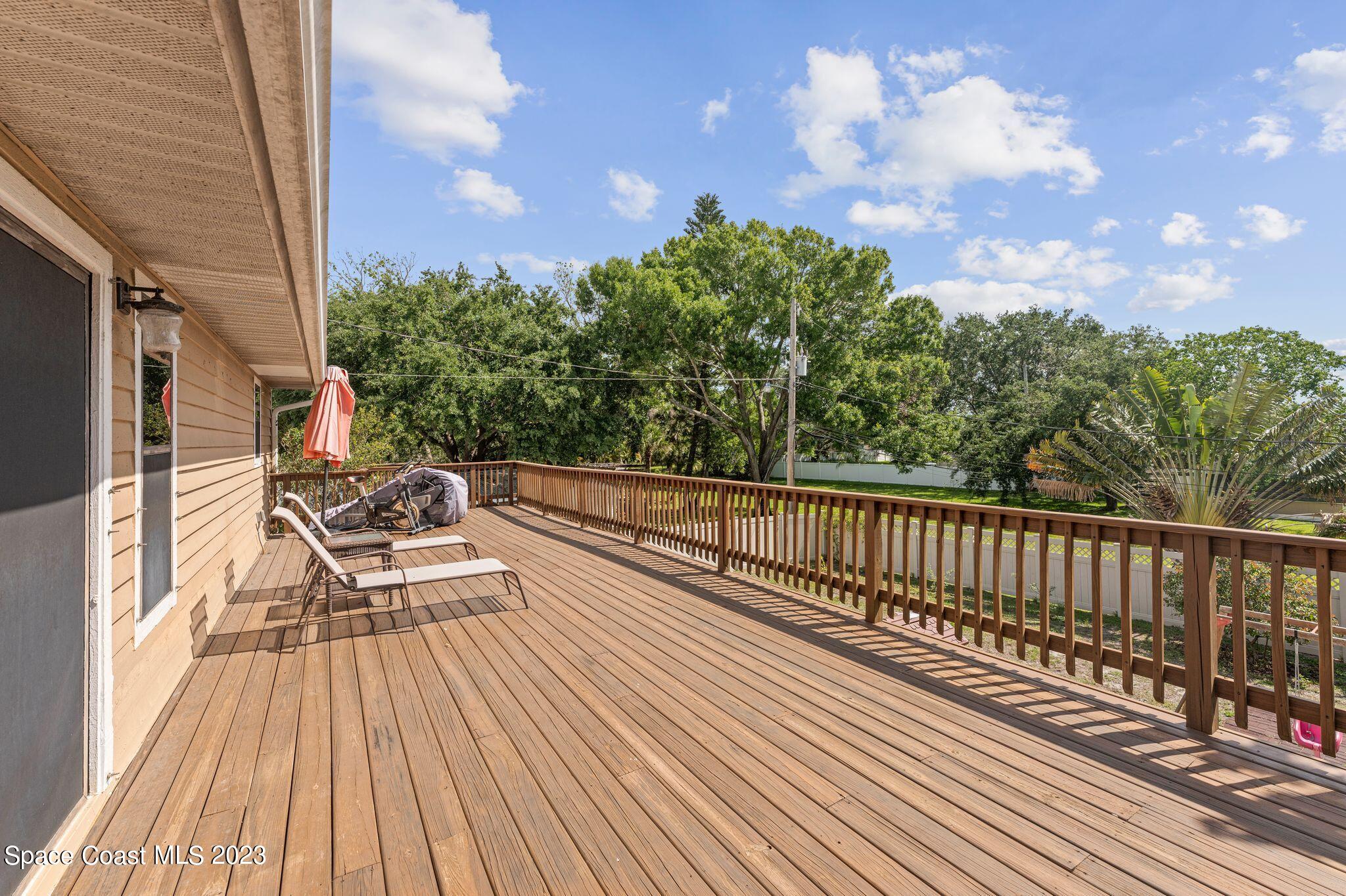 3704 Windsor Drive Cocoa, FL 32926 - Photo 22 of 48 a view of balcony with wooden floor and fence