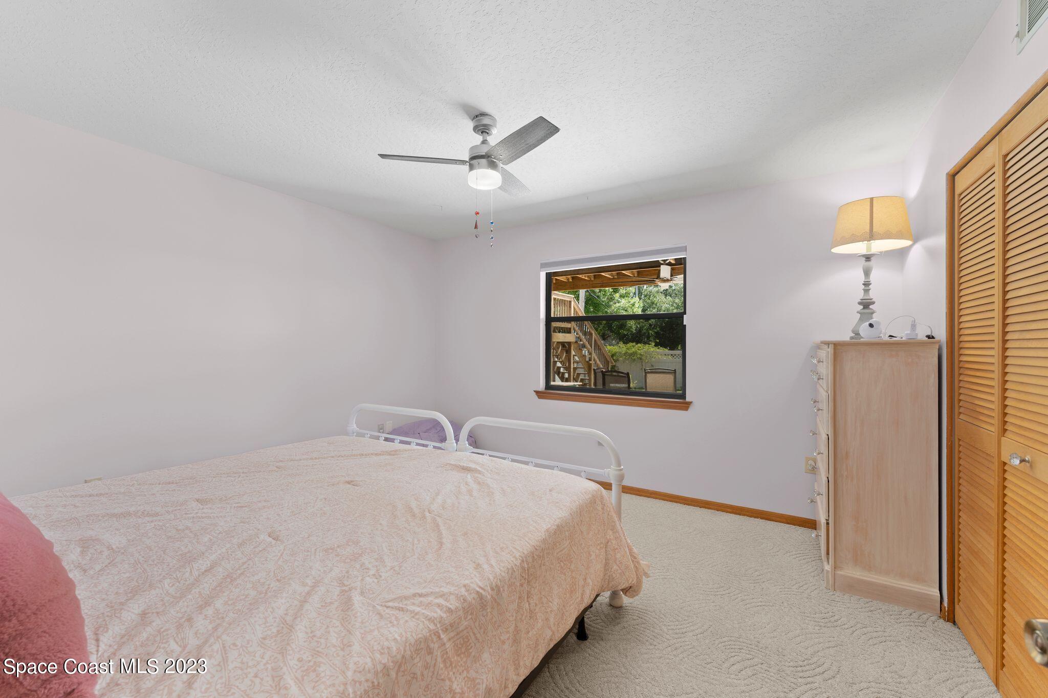 3704 Windsor Drive Cocoa, FL 32926 - Photo 31 of 48 a bedroom with a bed and a window