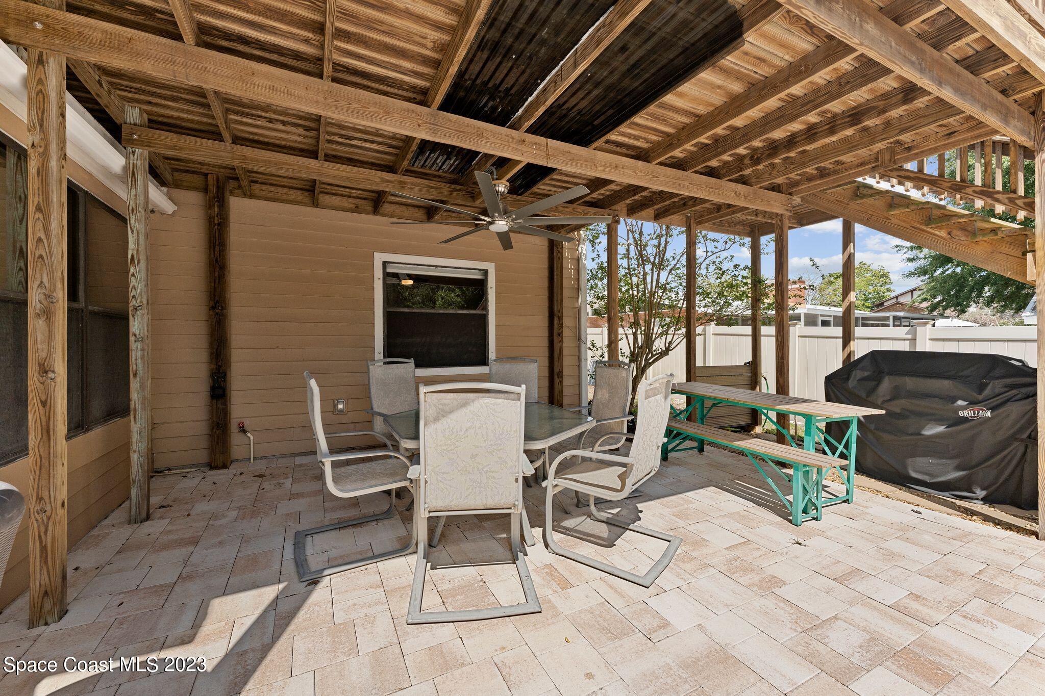 3704 Windsor Drive Cocoa, FL 32926 - Photo 35 of 48 a building outdoor space with patio furniture and potted plants