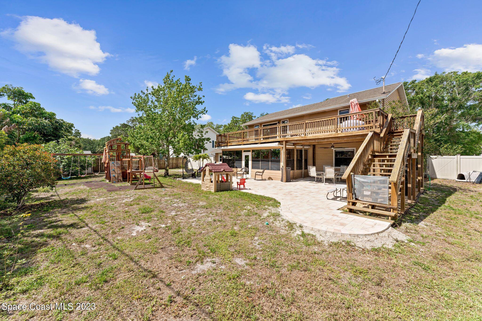 3704 Windsor Drive Cocoa, FL 32926 - Photo 37 of 48 a view of a house with backyard sitting area and garden