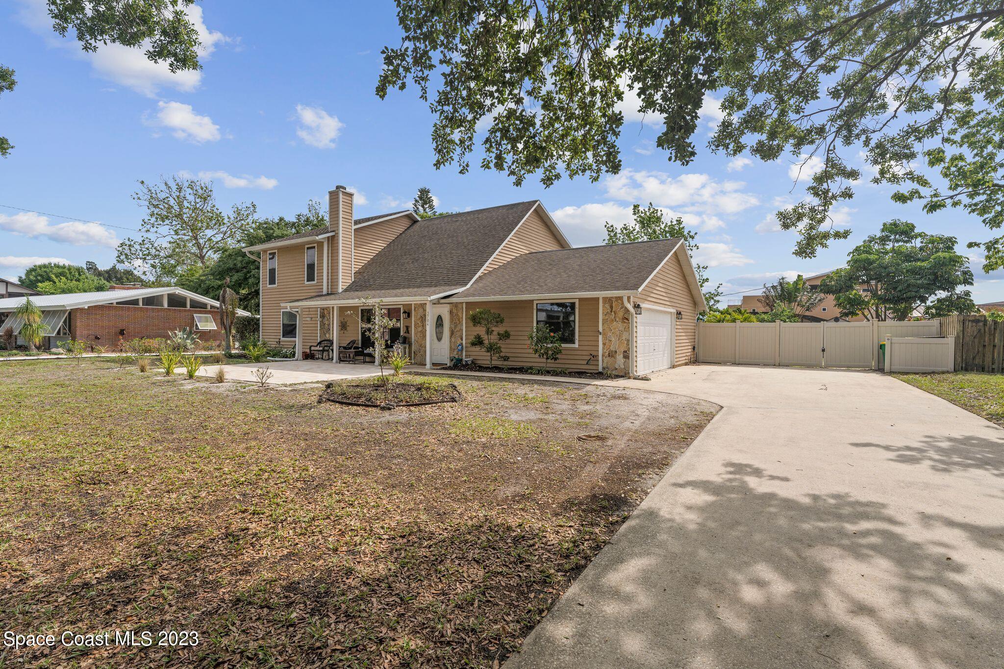 3704 Windsor Drive Cocoa, FL 32926 - Photo 4 of 48 a house with garden in the background