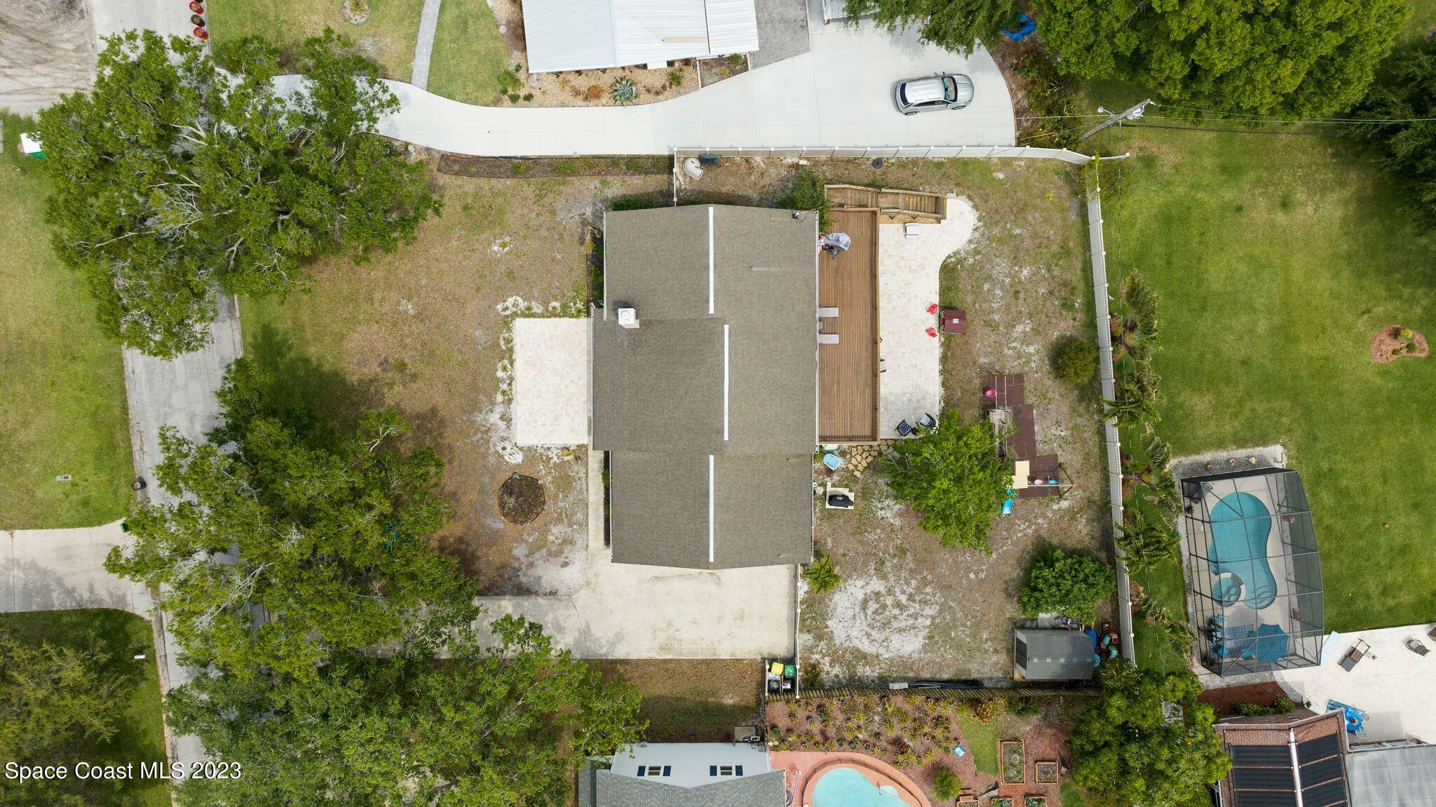 3704 Windsor Drive Cocoa, FL 32926 - Photo 43 of 48 an aerial view of a house with a yard and large tree