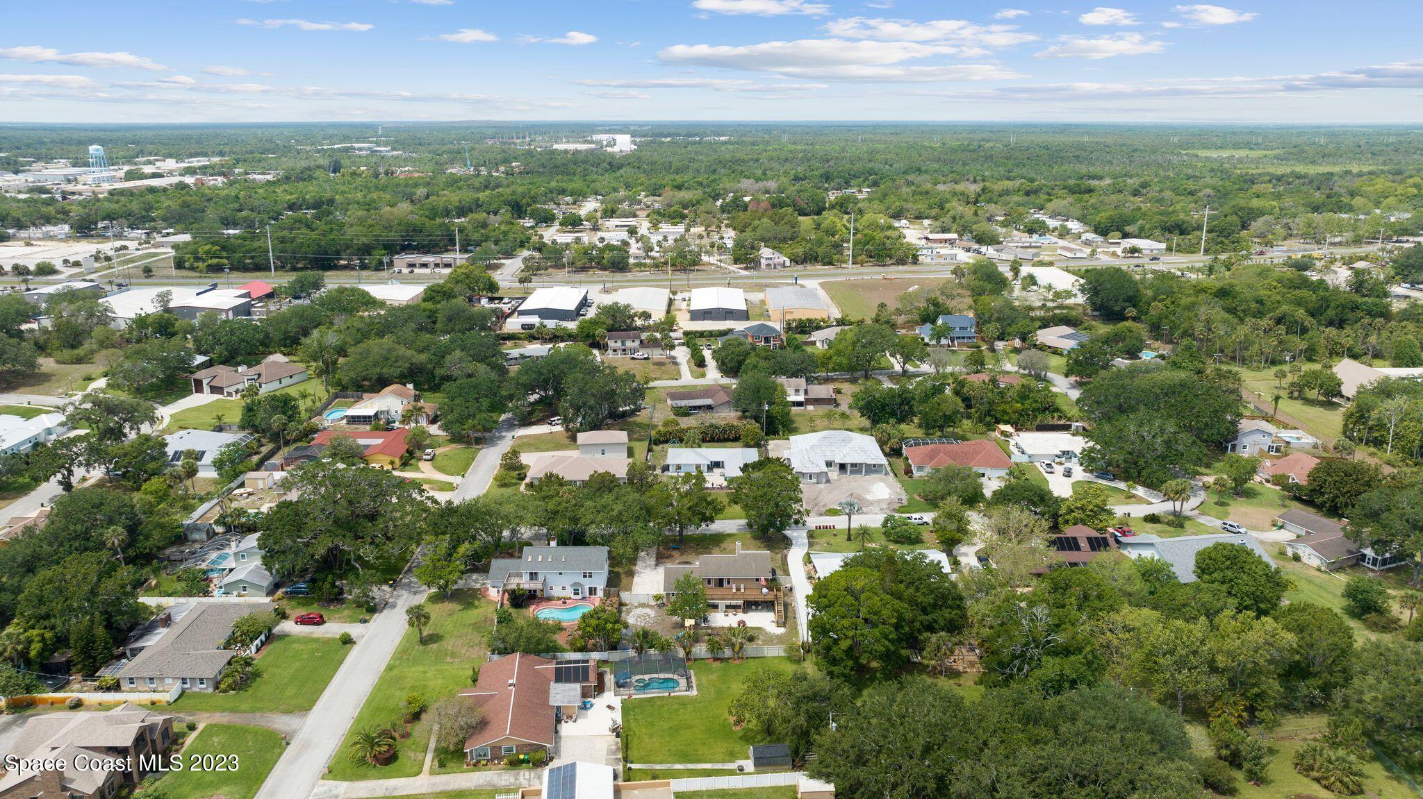 3704 Windsor Drive Cocoa, FL 32926 - Photo 44 of 48 an aerial view of residential houses with outdoor space and trees