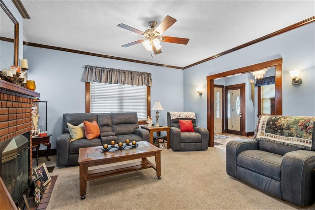 1170 Midland Beaver Road Industry, PA 15052 - Photo 14 of 34 a living room with furniture a ceiling fan and a large window