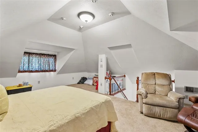 a bed room with furniture and a chandelier