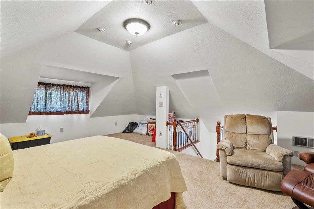 1170 Midland Beaver Road Industry, PA 15052 - Photo 28 of 34 a bed room with furniture and a chandelier