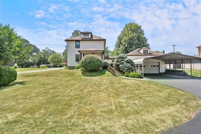 a front view of a house with a yard