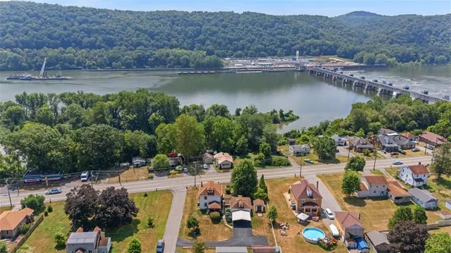 an aerial view of a city with lake view