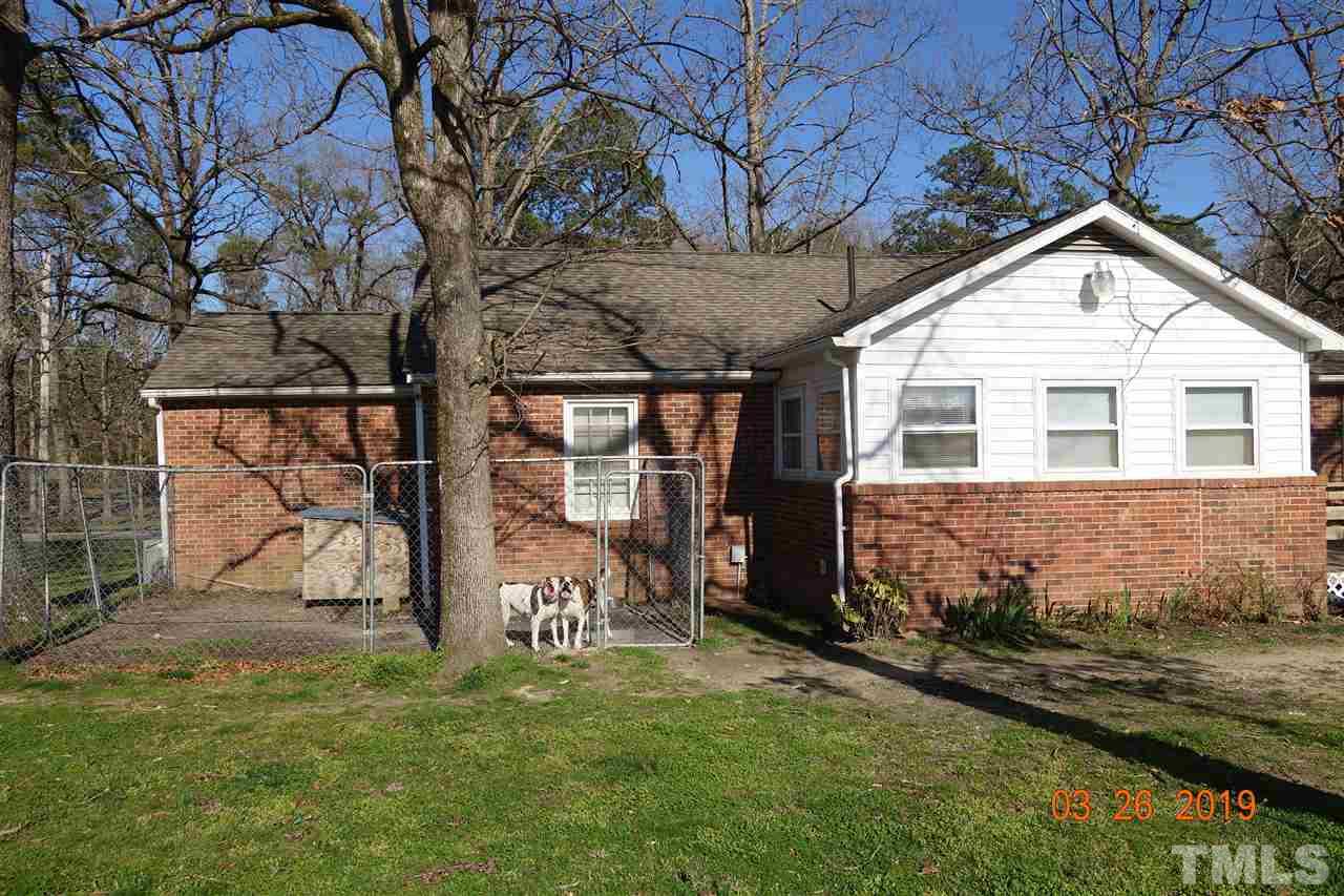245 Greystone Road Henderson, NC 27537 - Photo 22 of 26 A wide back view of the house
