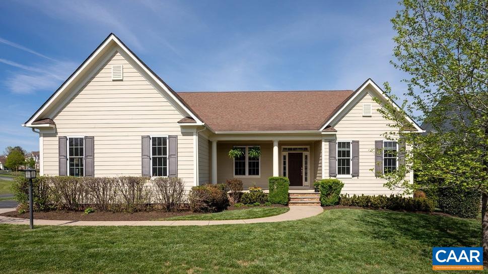 2706 Lockerbie Lane Keswick, VA 22947 - Photo 1 of 55 a front view of a house with a yard and porch