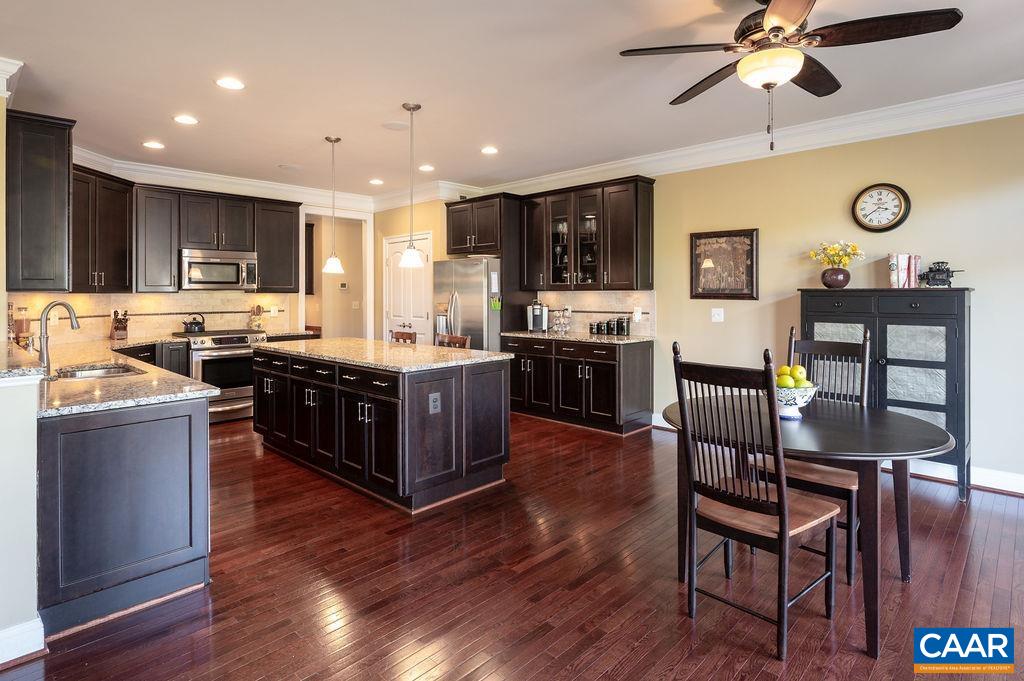 2706 Lockerbie Lane Keswick, VA 22947 - Photo 13 of 55 a large kitchen with cabinets table and chairs