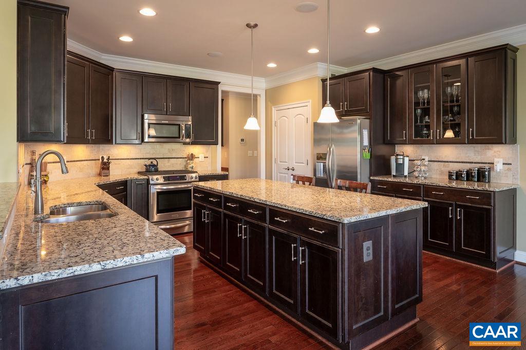 2706 Lockerbie Lane Keswick, VA 22947 - Photo 14 of 55 a kitchen with a stove sink and microwave