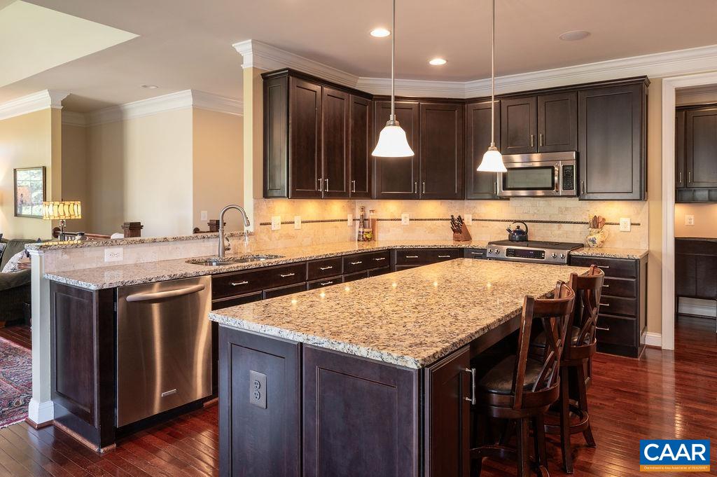 2706 Lockerbie Lane Keswick, VA 22947 - Photo 15 of 55 a kitchen with a stove a sink and a refrigerator