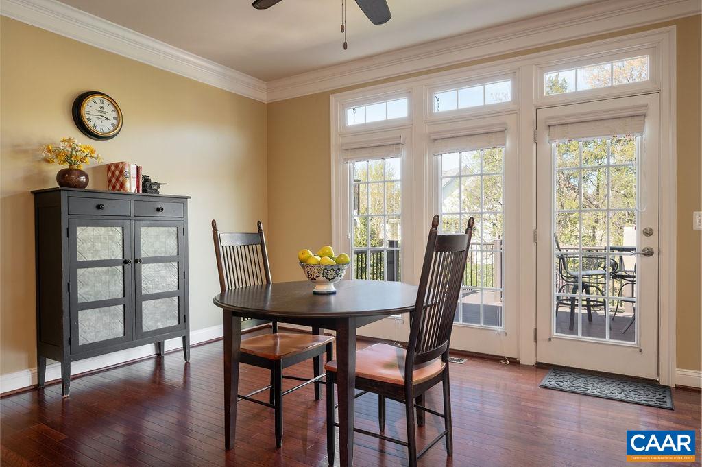 2706 Lockerbie Lane Keswick, VA 22947 - Photo 16 of 55 a view of a dining room with furniture window and wooden floor