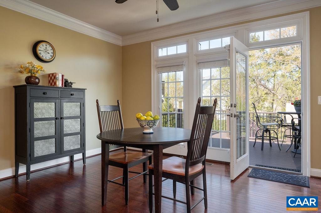 2706 Lockerbie Lane Keswick, VA 22947 - Photo 17 of 55 a view of a dining room with furniture window and wooden floor