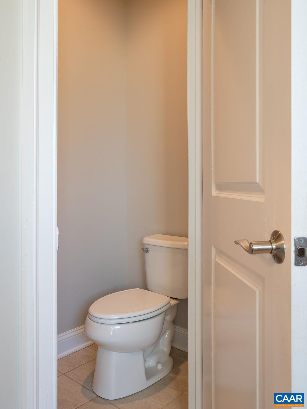 2706 Lockerbie Lane Keswick, VA 22947 - Photo 24 of 55 a white toilet sitting next to a shower