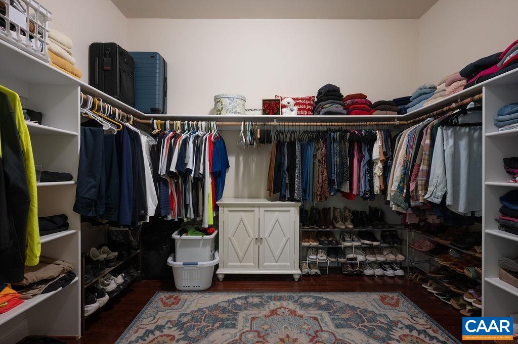 2706 Lockerbie Lane Keswick, VA 22947 - Photo 25 of 55 a view of walk in closet with clothes and shoes