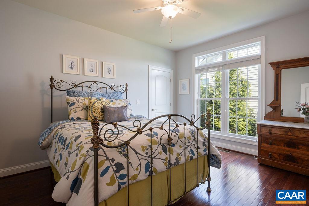 2706 Lockerbie Lane Keswick, VA 22947 - Photo 27 of 55 a bedroom with a bed and a tv on table