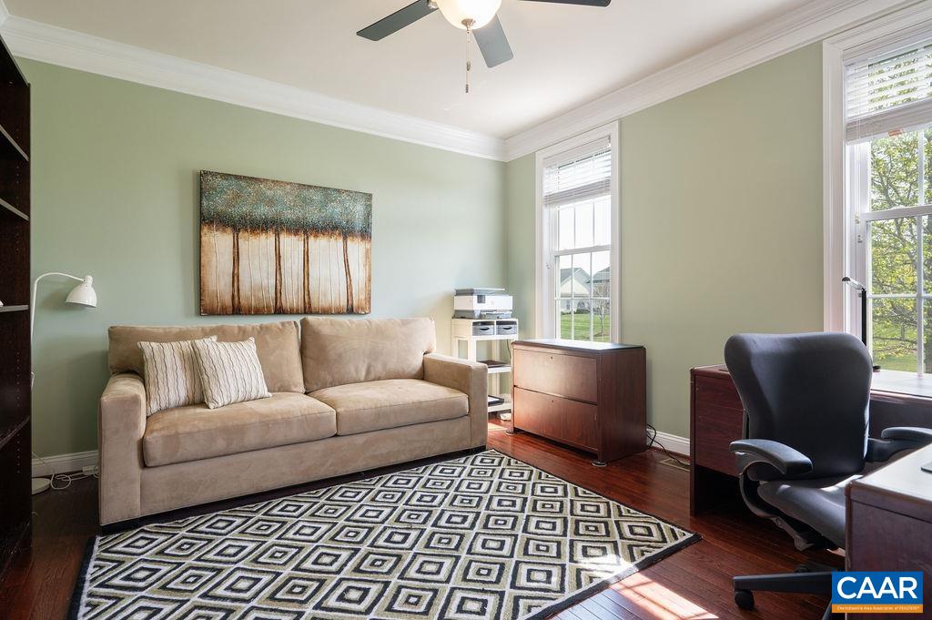 2706 Lockerbie Lane Keswick, VA 22947 - Photo 29 of 55 a living room with furniture and a window