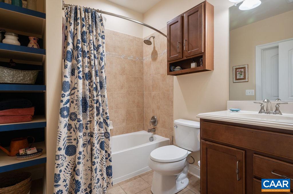 2706 Lockerbie Lane Keswick, VA 22947 - Photo 35 of 55 a bathroom with a sink toilet and shower