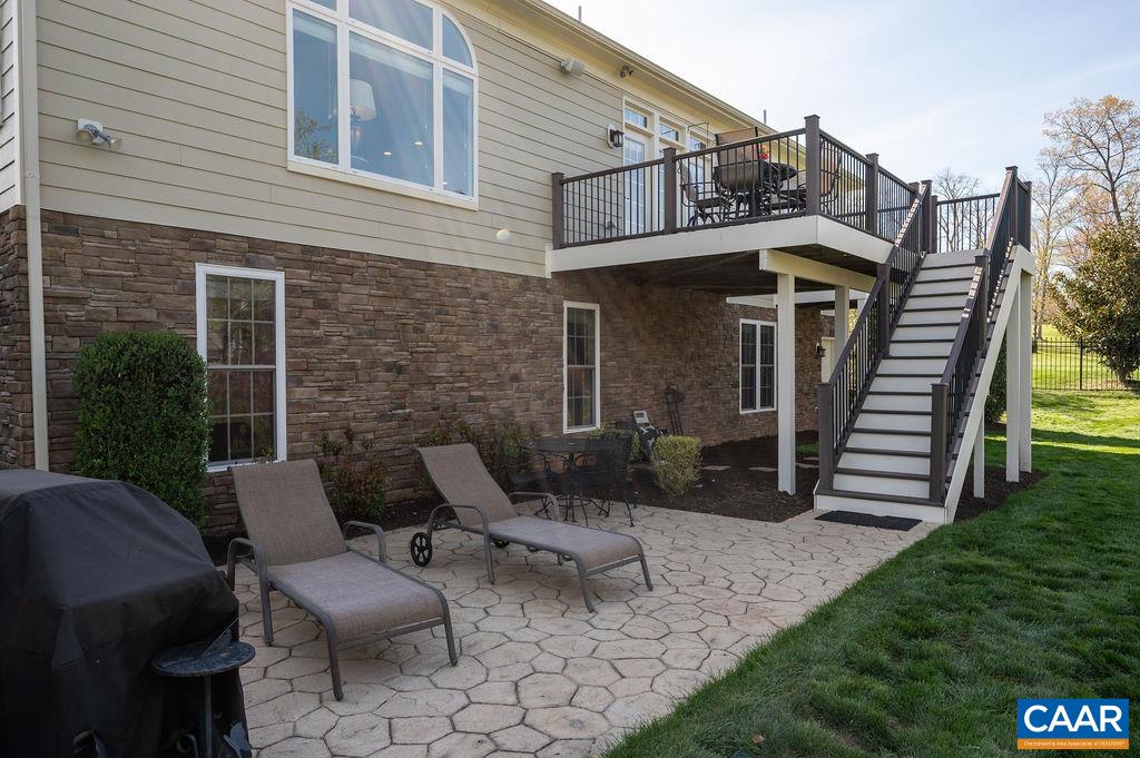 2706 Lockerbie Lane Keswick, VA 22947 - Photo 38 of 55 a view of a patio with a table and chairs