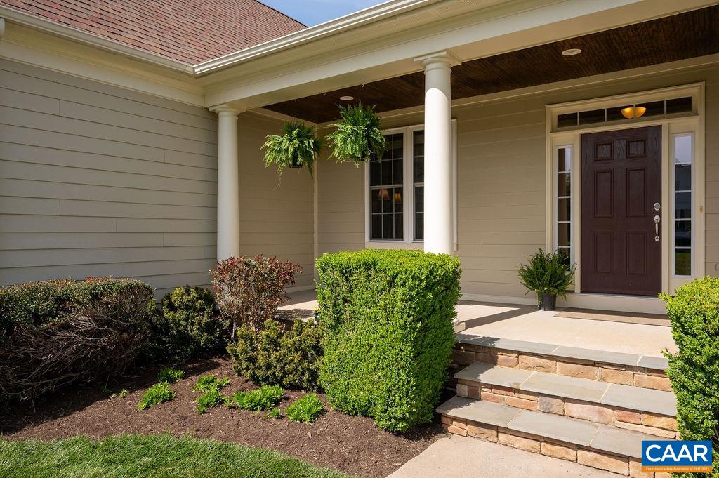 2706 Lockerbie Lane Keswick, VA 22947 - Photo 5 of 55 a front view of a house with plants