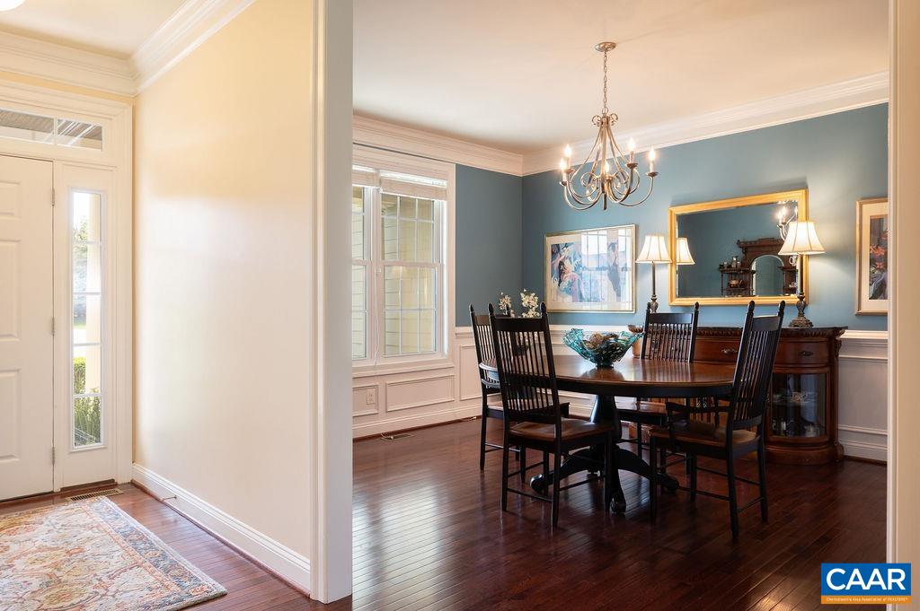 2706 Lockerbie Lane Keswick, VA 22947 - Photo 8 of 55 a view of a dining room with furniture window and wooden floor