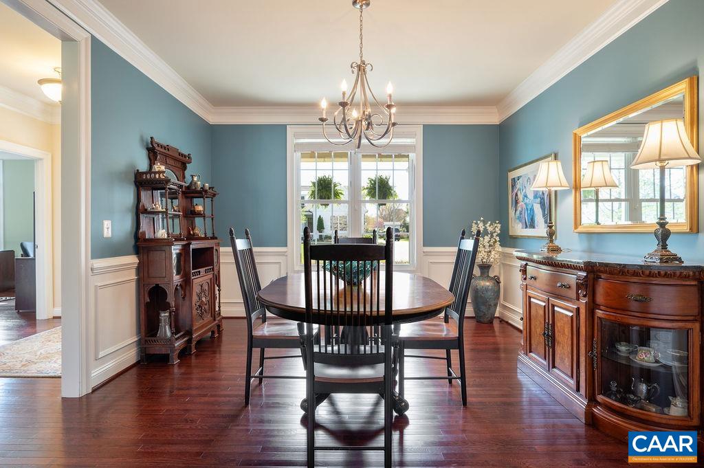 2706 Lockerbie Lane Keswick, VA 22947 - Photo 9 of 55 a view of a dining room with furniture window and wooden floor