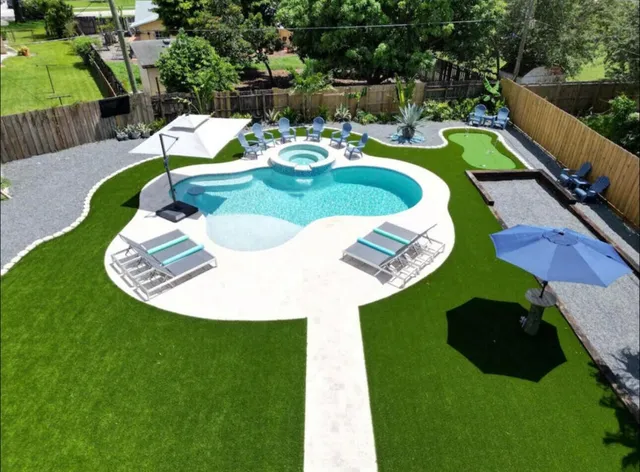 an aerial view of a house with outdoor space