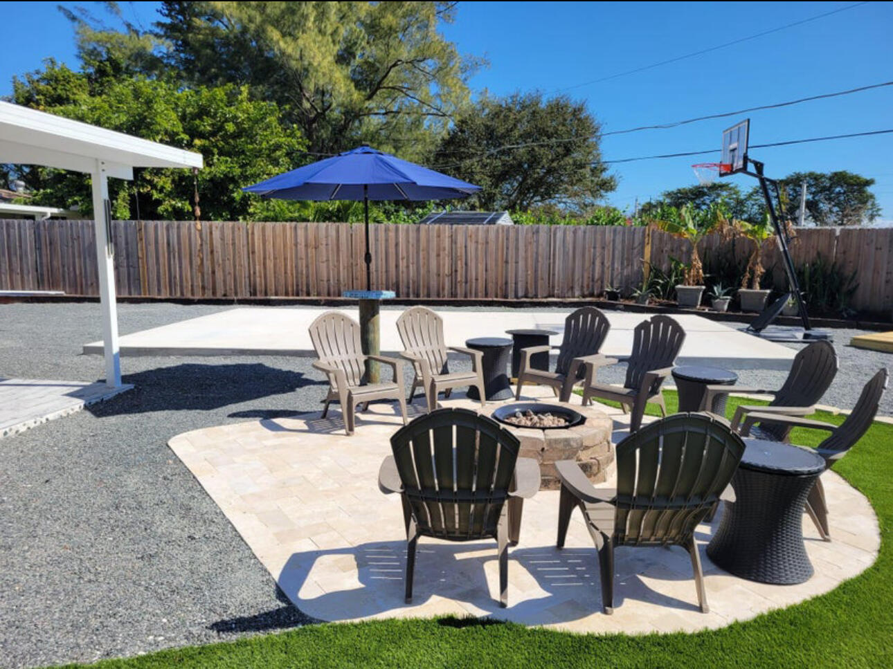 270 Northwest 36th Street Boca Raton, FL 33431 - Photo 17 of 82 a view of a patio with table and chairs with wooden fence