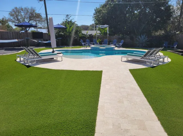 a view of a swimming pool with a patio