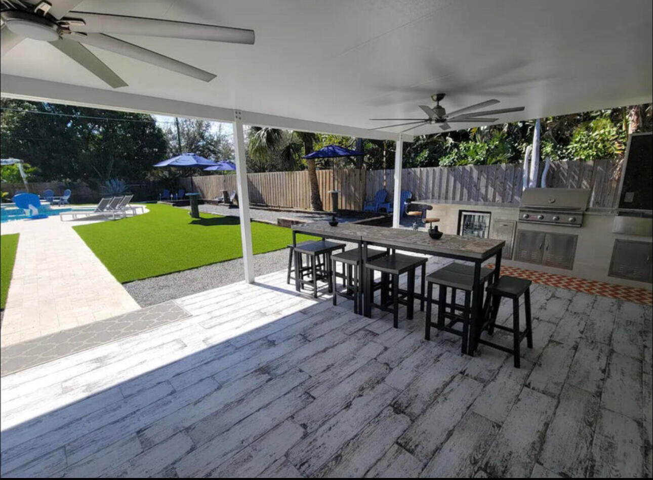 270 Northwest 36th Street Boca Raton, FL 33431 - Photo 22 of 82 a view of a dining room with furniture and wooden floor