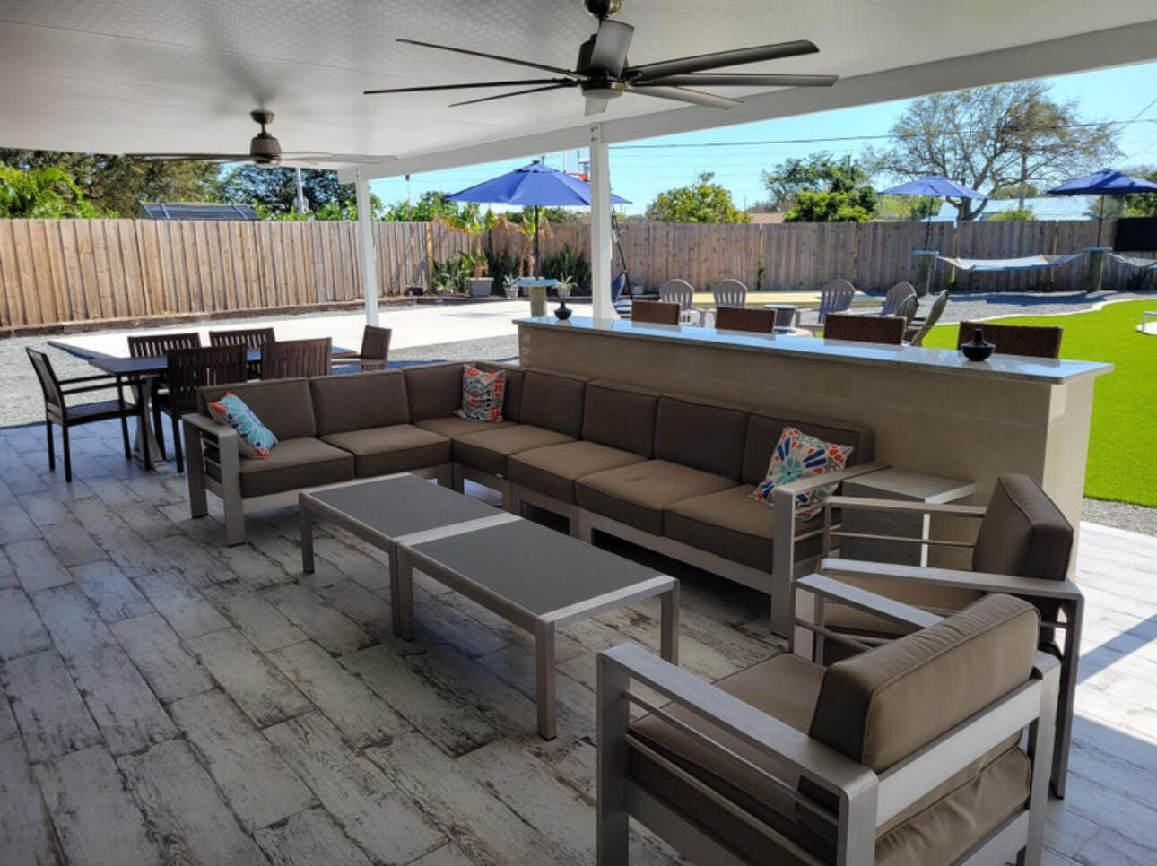 270 Northwest 36th Street Boca Raton, FL 33431 - Photo 25 of 82 a outdoor living space with patio furniture and a fireplace