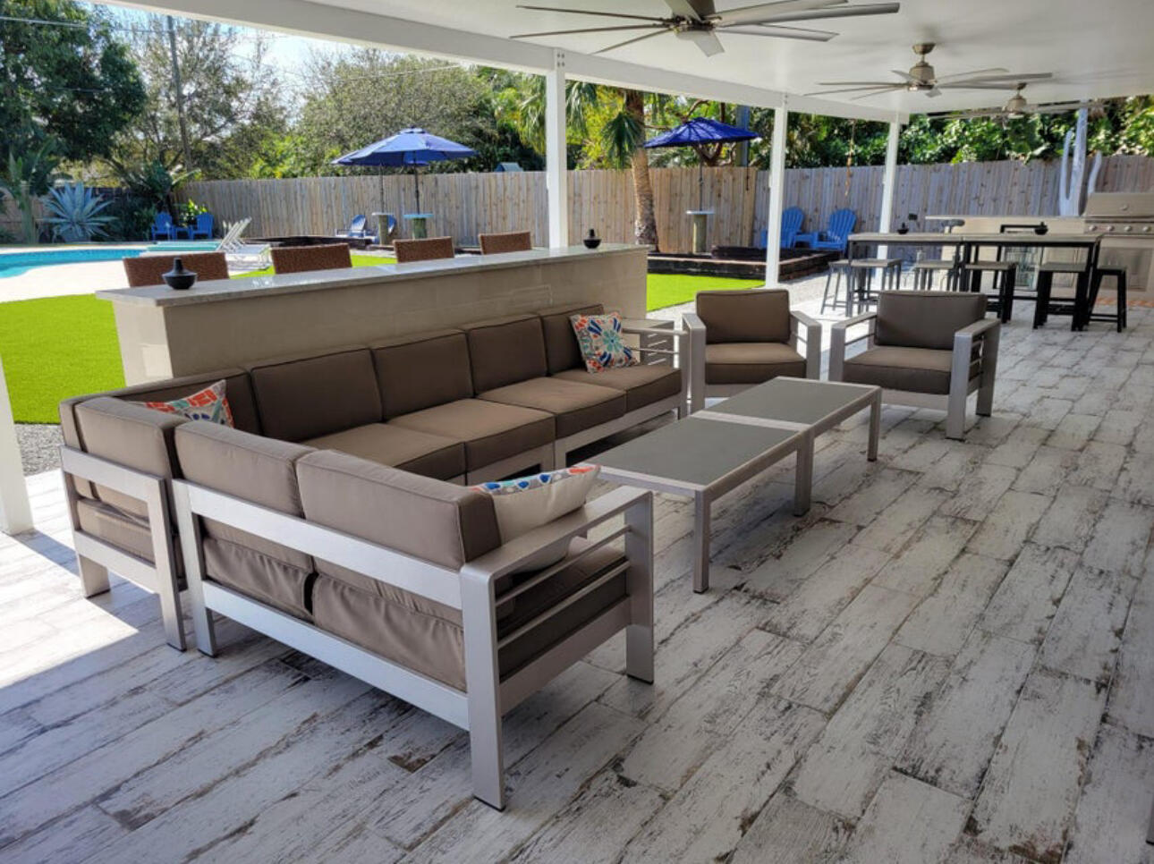 270 Northwest 36th Street Boca Raton, FL 33431 - Photo 26 of 82 a view of a patio with couches and chairs with wooden floor