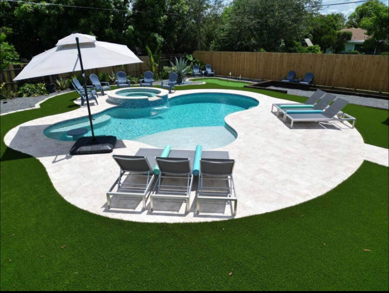 270 Northwest 36th Street Boca Raton, FL 33431 - Photo 3 of 82 a view of a swimming pool with a patio