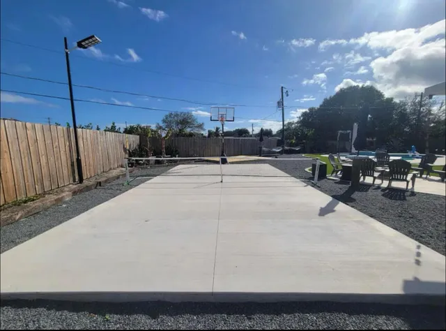 a bathroom with a sink toilet and mirror