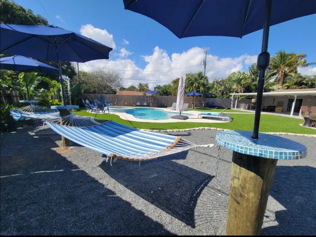 a view of a swimming pool with sitting area