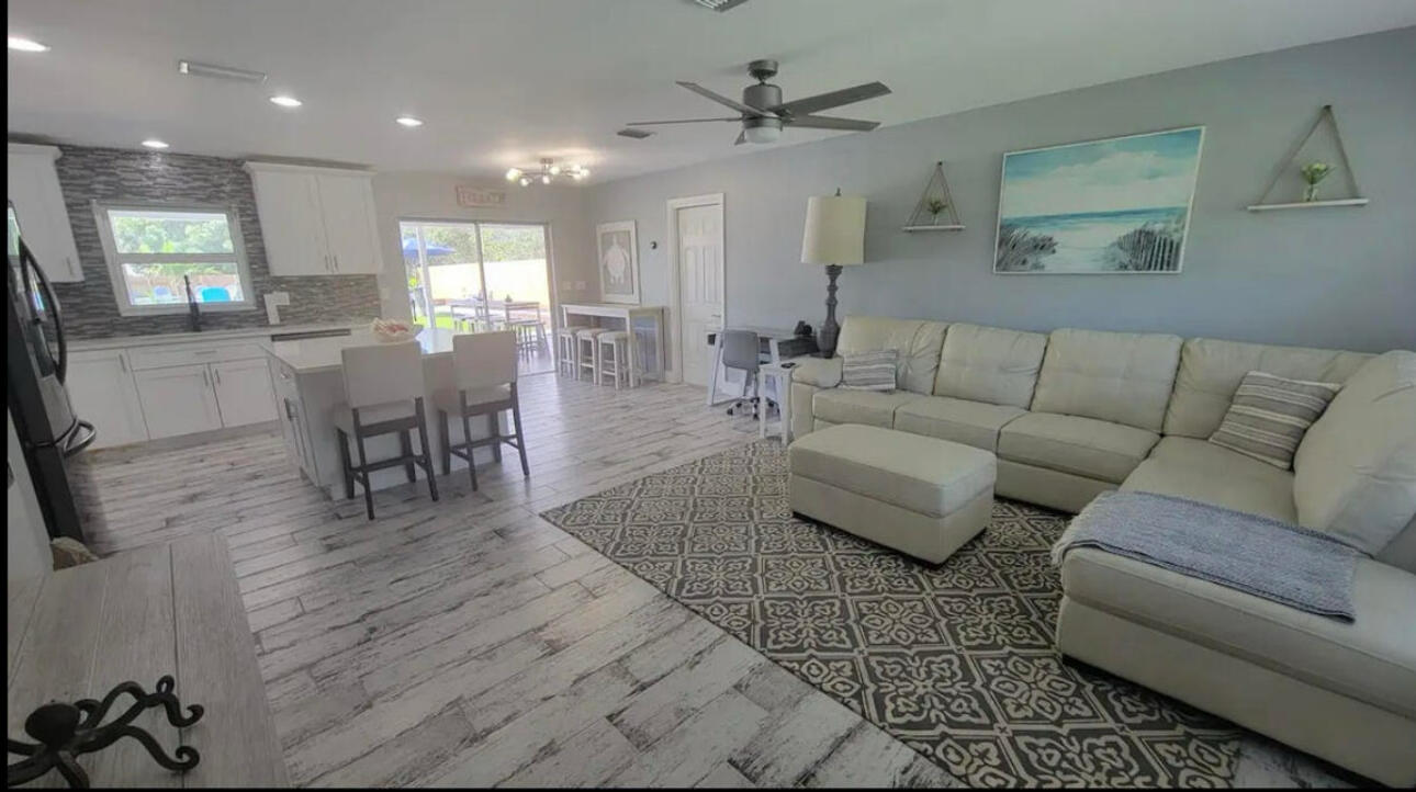 270 Northwest 36th Street Boca Raton, FL 33431 - Photo 54 of 82 a living room with furniture and a wooden floor