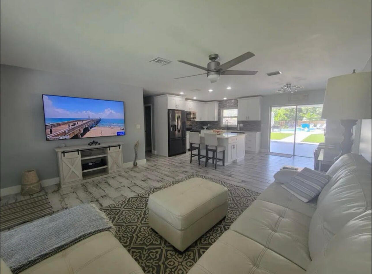 270 Northwest 36th Street Boca Raton, FL 33431 - Photo 55 of 82 a living room with furniture and a flat screen tv