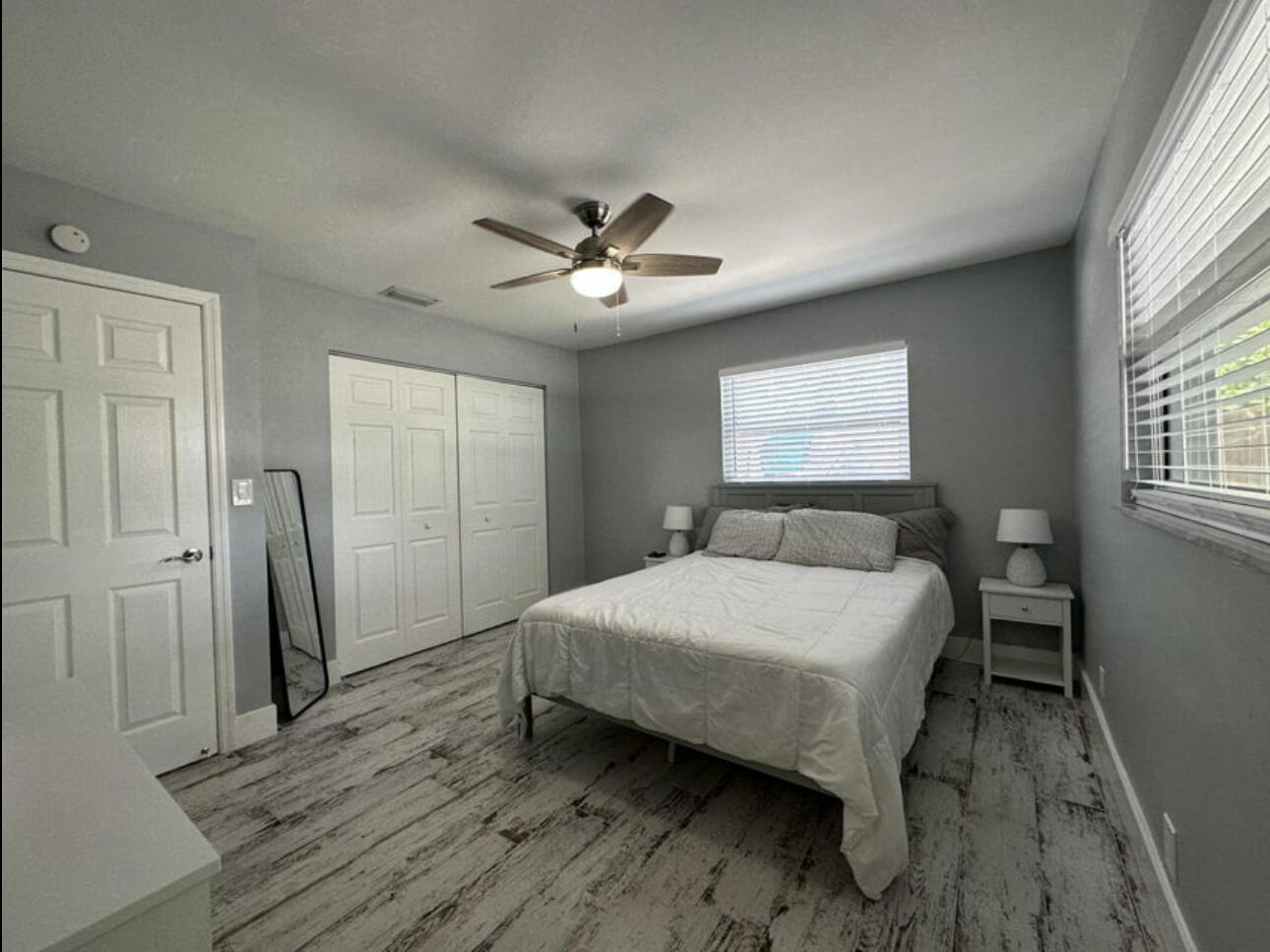 270 Northwest 36th Street Boca Raton, FL 33431 - Photo 61 of 82 a bedroom with a bed and a chandelier