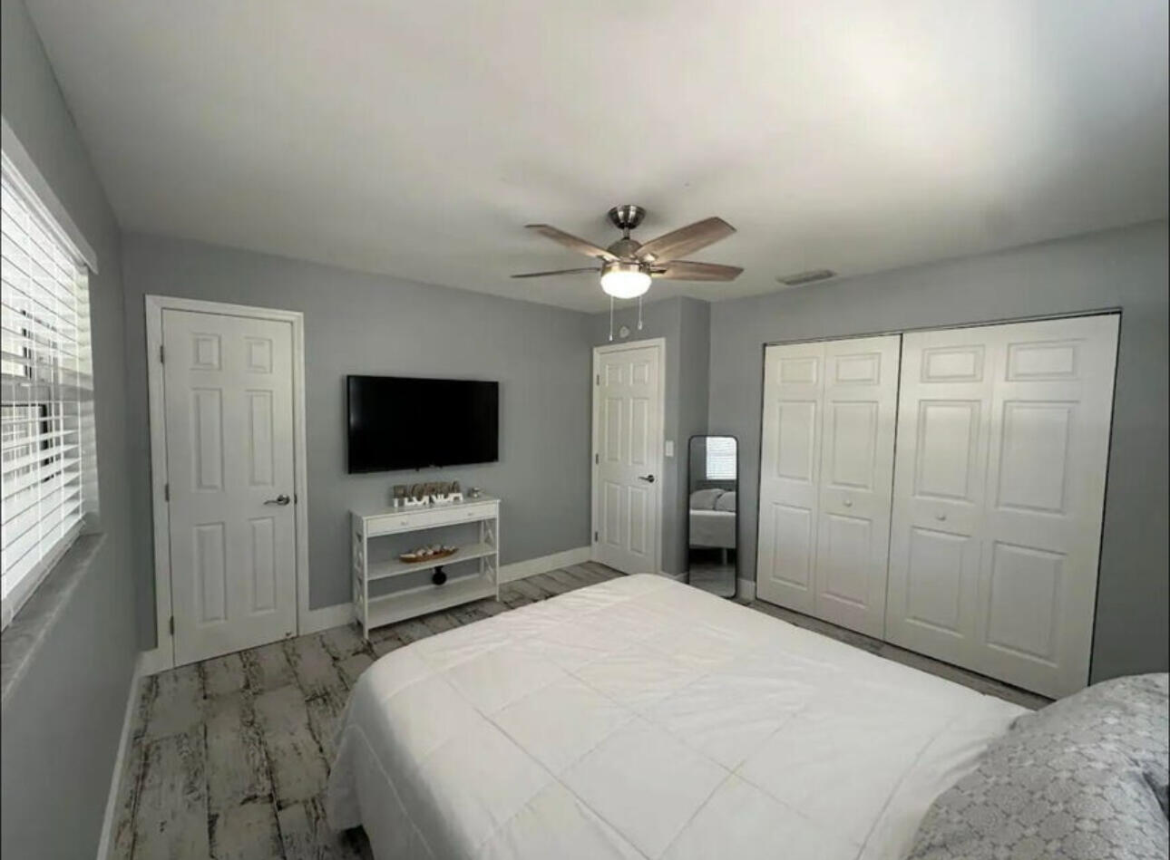 270 Northwest 36th Street Boca Raton, FL 33431 - Photo 62 of 82 a bedroom with a bed and a flat screen tv
