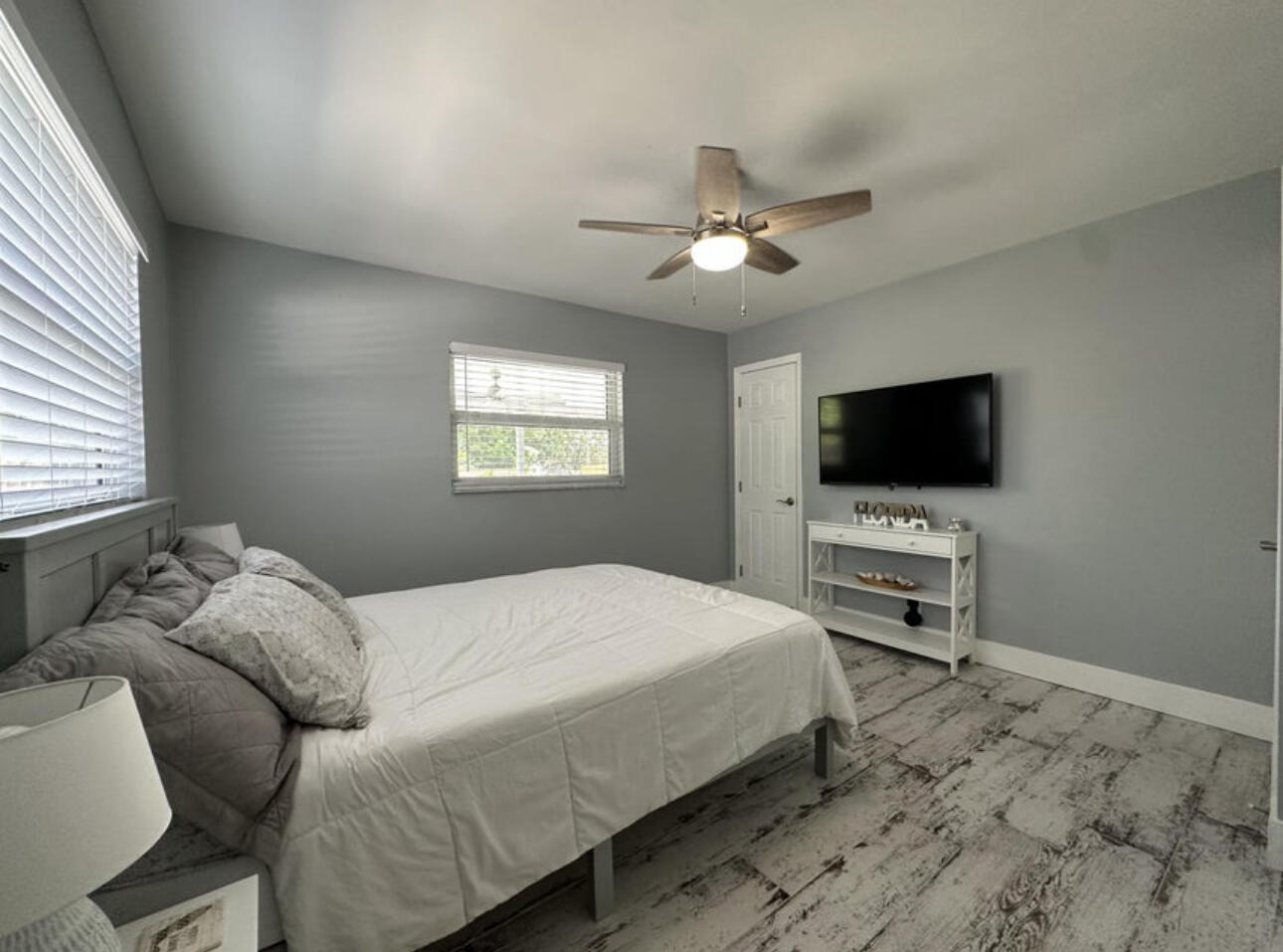 270 Northwest 36th Street Boca Raton, FL 33431 - Photo 63 of 82 a bedroom with a bed and a flat screen tv