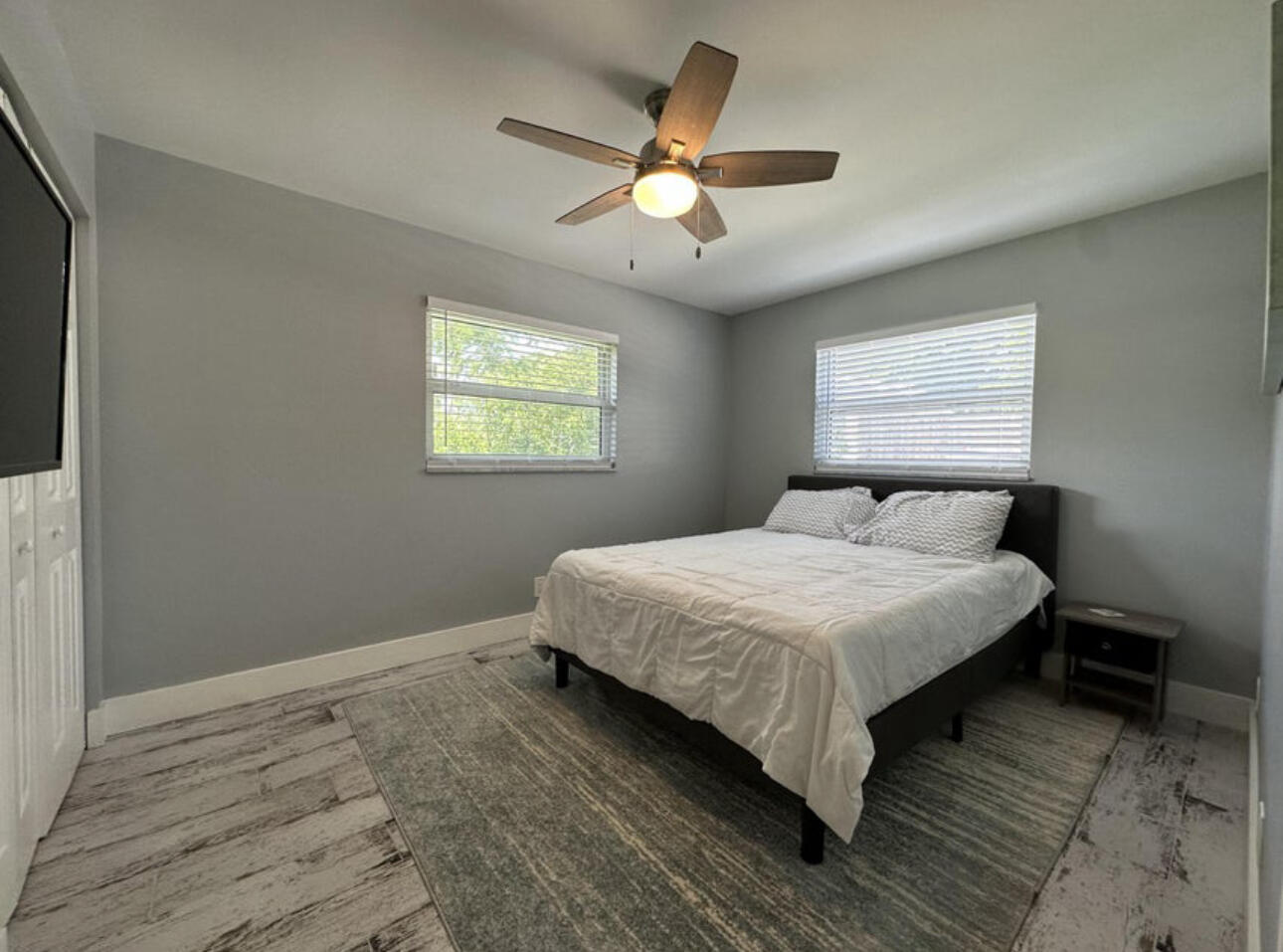 270 Northwest 36th Street Boca Raton, FL 33431 - Photo 64 of 82 a bedroom with a bed and window